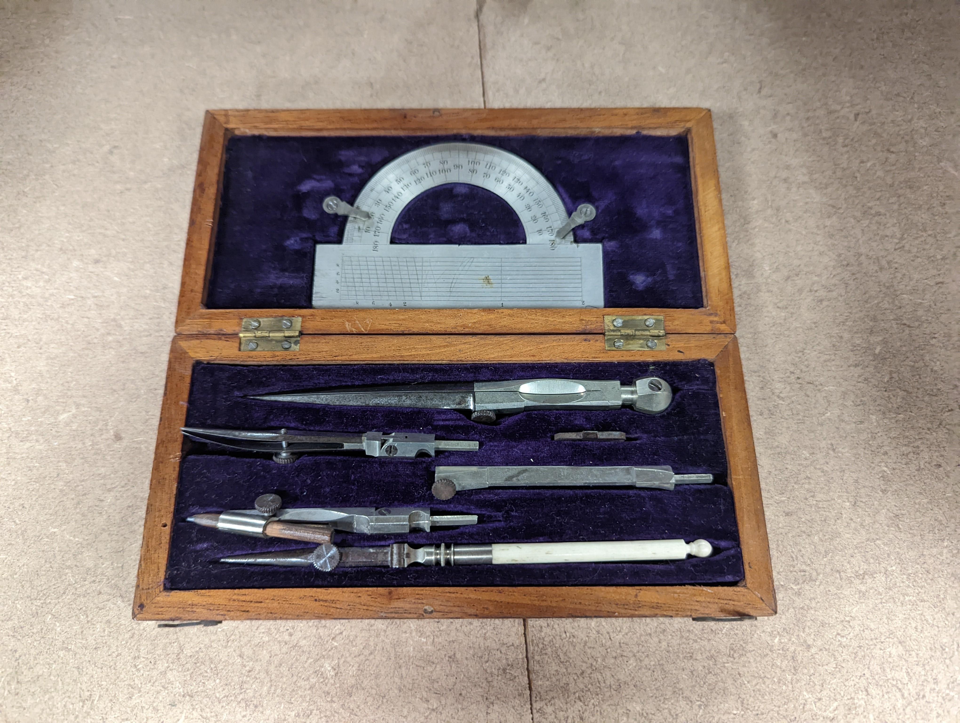 A collection of mahogany cased drawing instruments (8)
